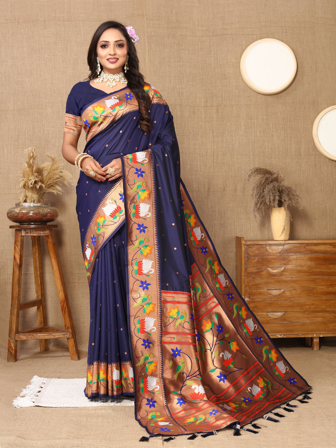 Stunning navy Paithani silk saree with exquisite meenakari weaving and golden zari border, perfect for festive occasions.