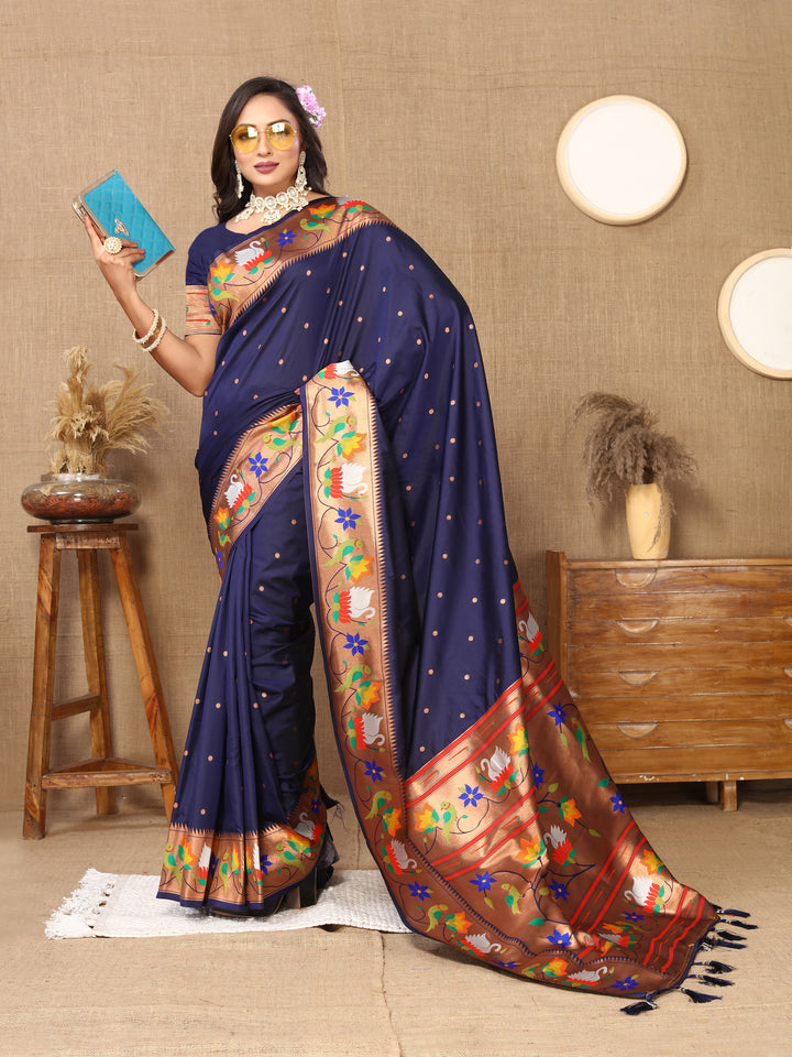 Beautiful navy Paithani silk saree with rich meenakari weaving and a golden zari border, perfect for cultural celebrations.