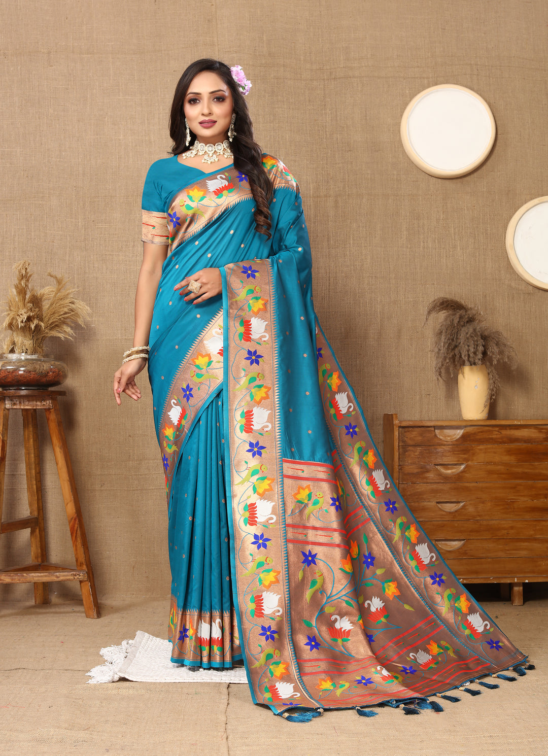 Stunning sky-blue Paithani silk saree with exquisite meenakari weaving and a beautiful zari border, perfect for bridal wear.