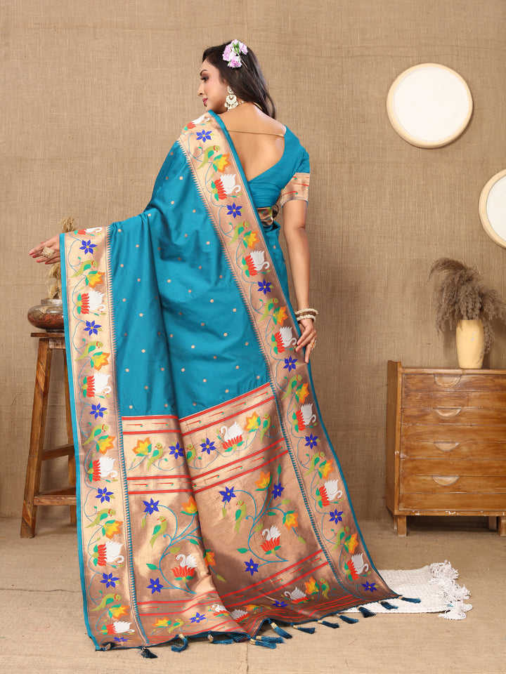 Gorgeous sky-blue Paithani silk saree with intricate meenakari weaving and a luxurious zari border, ideal for cultural celebrations.