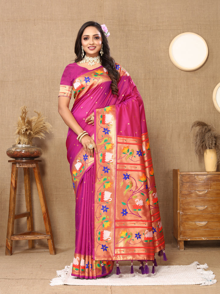 Gorgeous bright-pink Paithani silk saree with delicate meenakari weaving and a gold zari border, perfect for weddings.