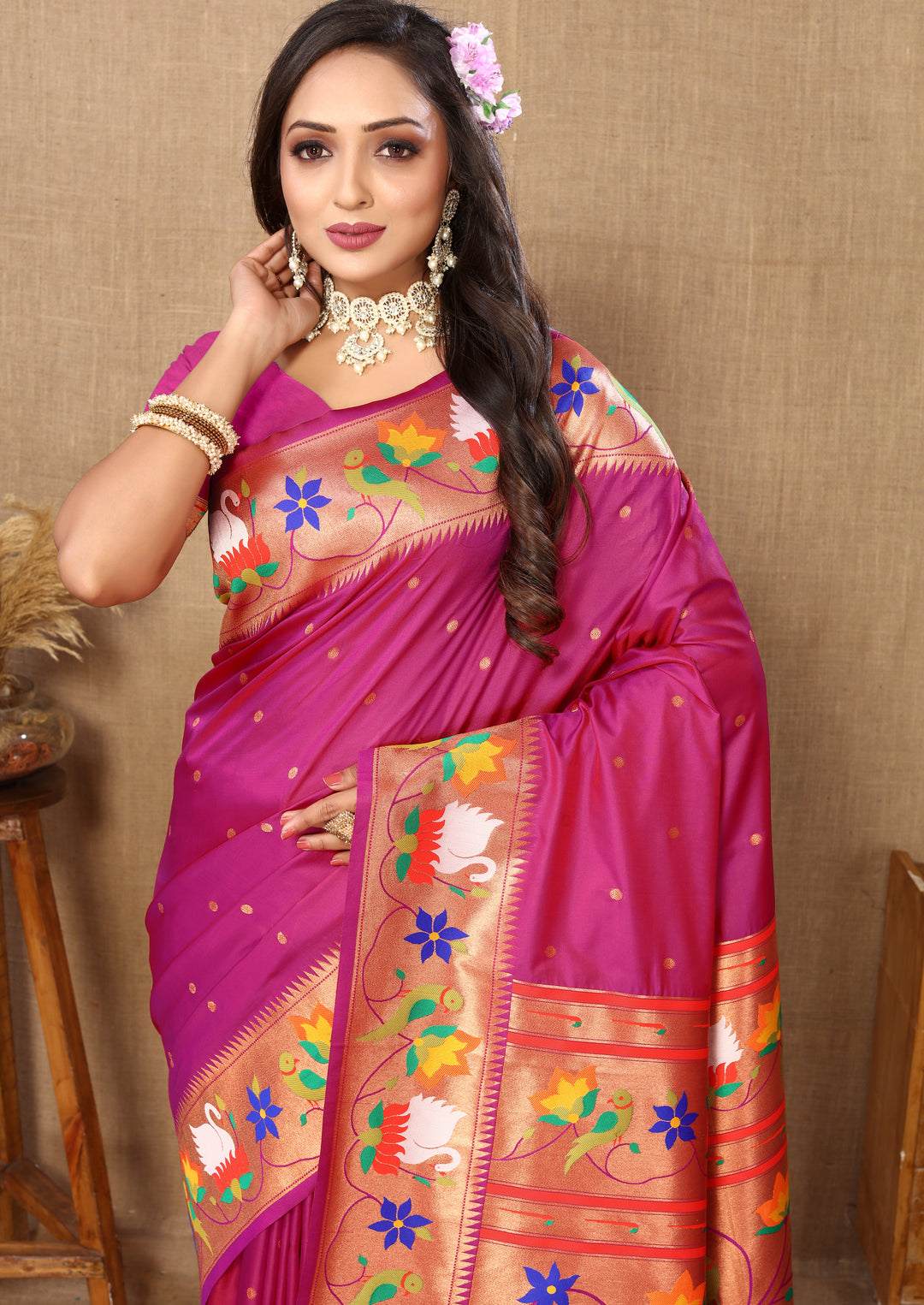 Stunning bright-pink Paithani silk saree with exquisite meenakari weaving and a beautiful zari border, ideal for cultural gatherings.