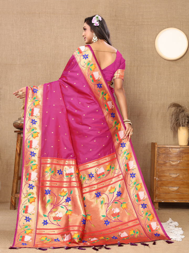 Beautiful bright-pink Paithani silk saree with intricate meenakari weaving and a luxurious zari border, perfect for bridal wear.