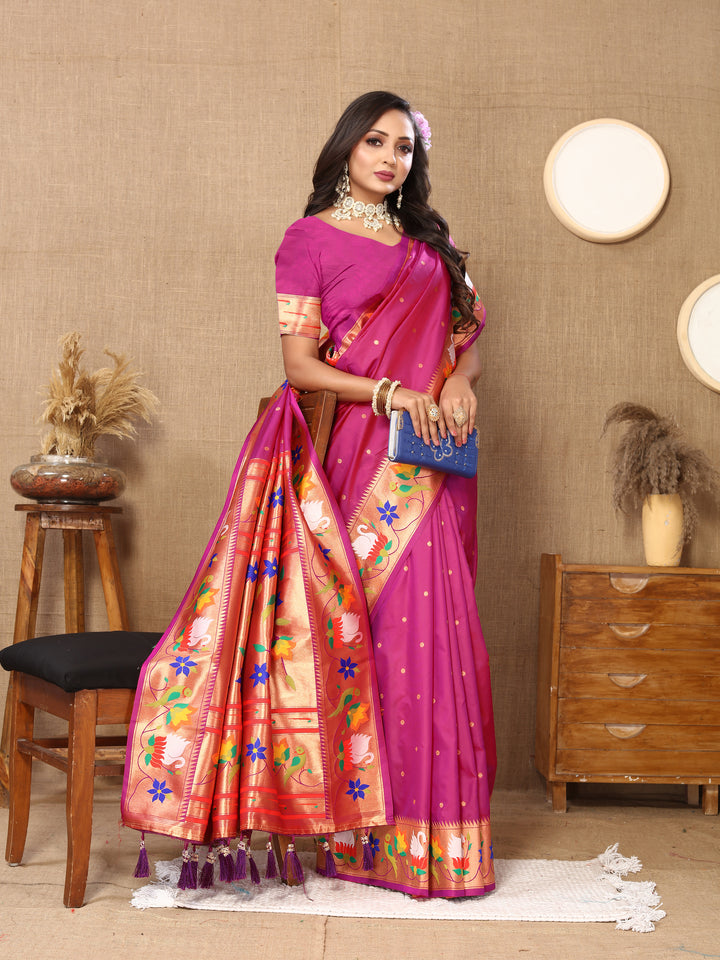 Gorgeous bright-pink Paithani silk saree with detailed meenakari weaving and a dazzling zari border, ideal for special events.