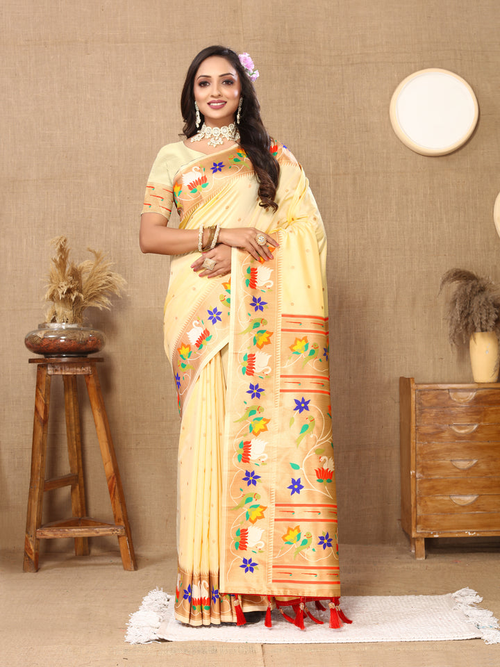 Stunning beige Paithani silk saree with intricate meenakari work and a golden zari border, perfect for weddings.