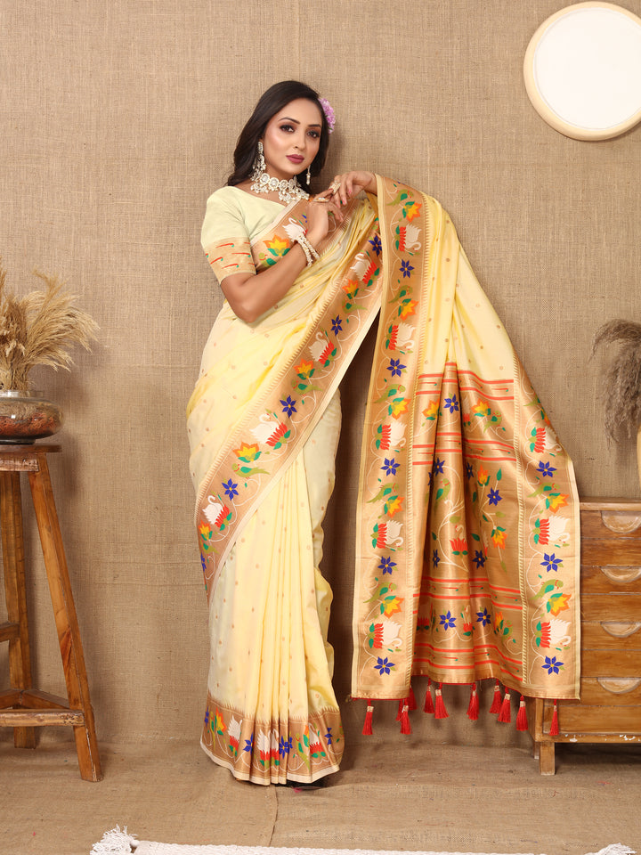 Pale-pink Paithani silk saree with delicate meenakari weaving and a luxurious zari border, ideal for weddings.