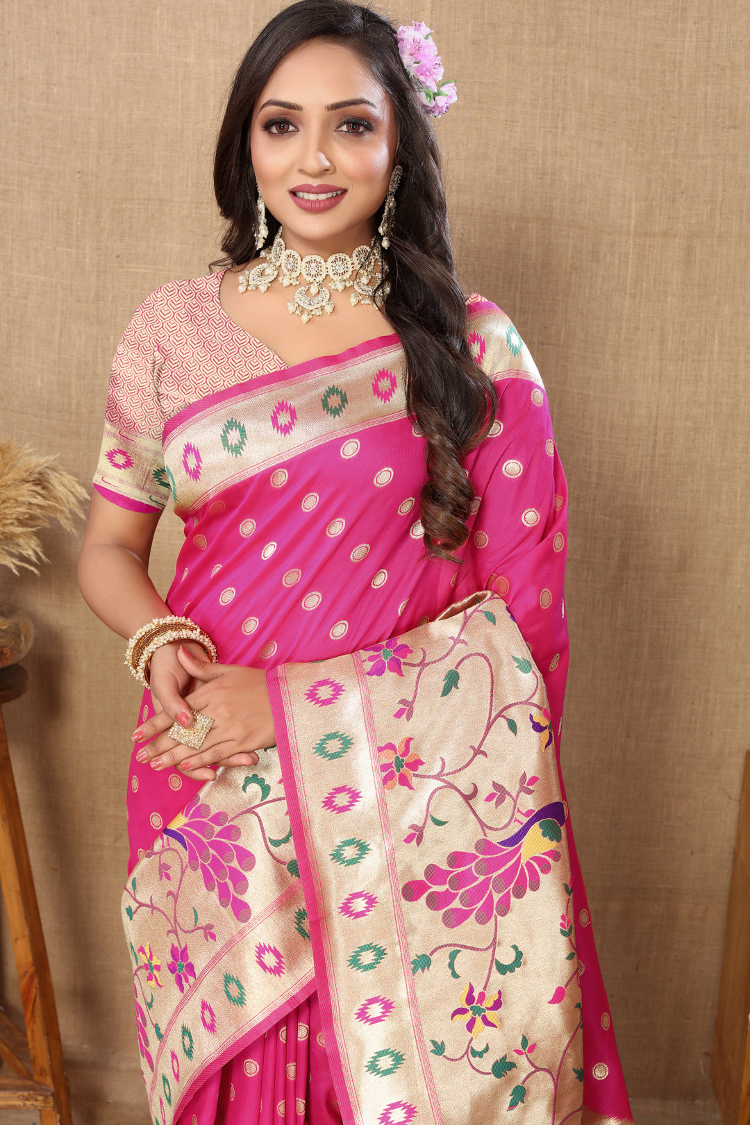 Elegant pink silk saree featuring rich zari work and a luxurious silk blouse, perfect for weddings.