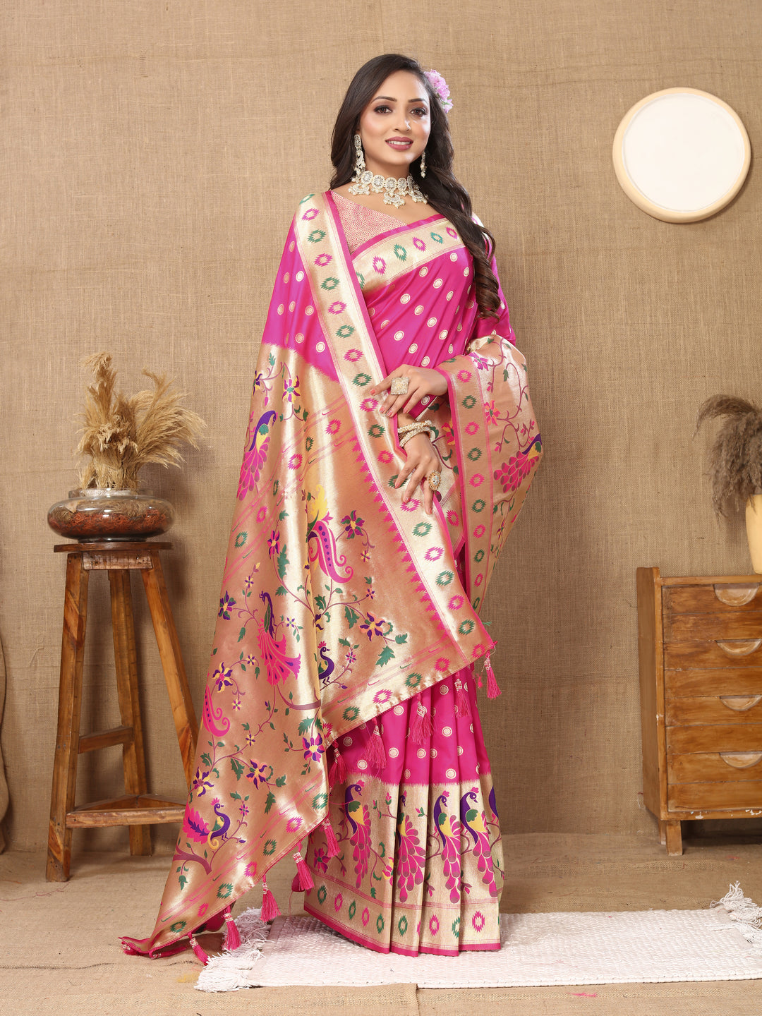 Pink Paithani saree with intricate zari weaving, ideal for traditional gatherings.