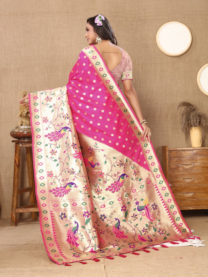 Classic pink silk saree with ornate zari and matching silk blouse piece, perfect for Indian events.