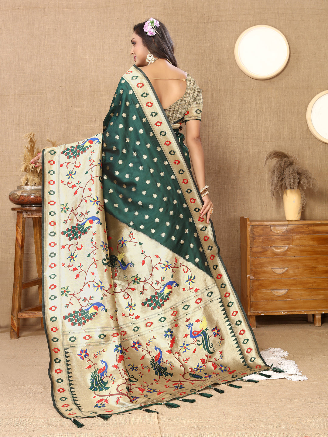 Classic teal-green silk saree with detailed zari pallu and silk blouse, perfect for cultural events.