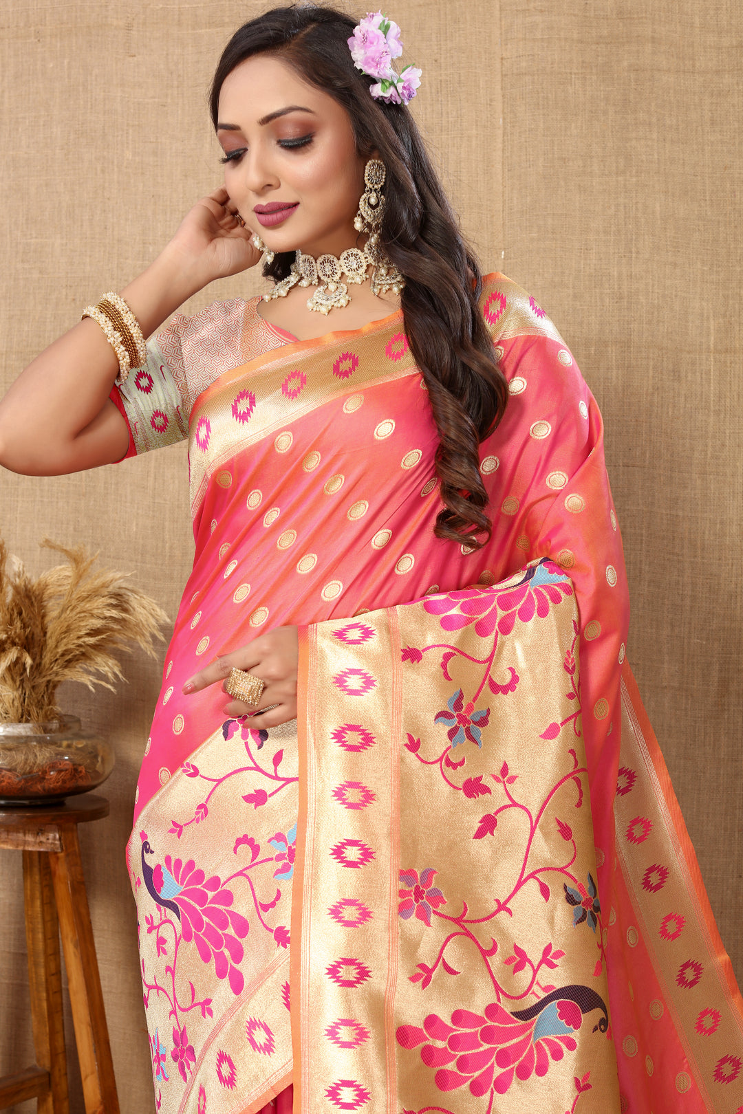 Elegant peach silk saree featuring detailed zari weaving and silk blouse, perfect for weddings.