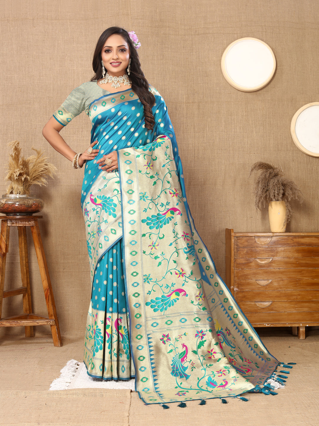 Turquoise Paithani silk saree with rich zari weaving, perfect for festive gatherings.