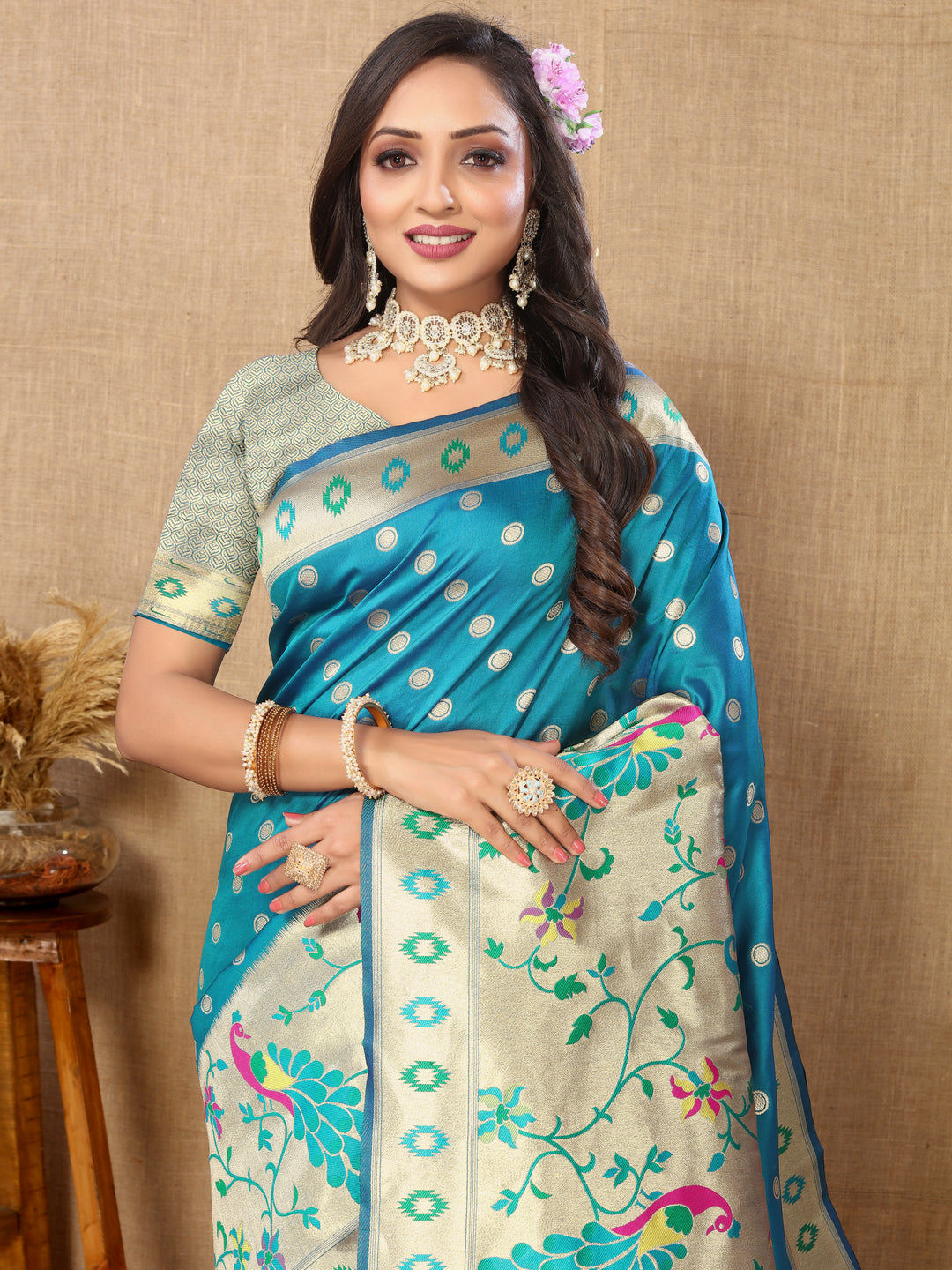 Elegant turquoise silk saree featuring ornate zari details and silk blouse, ideal for weddings.