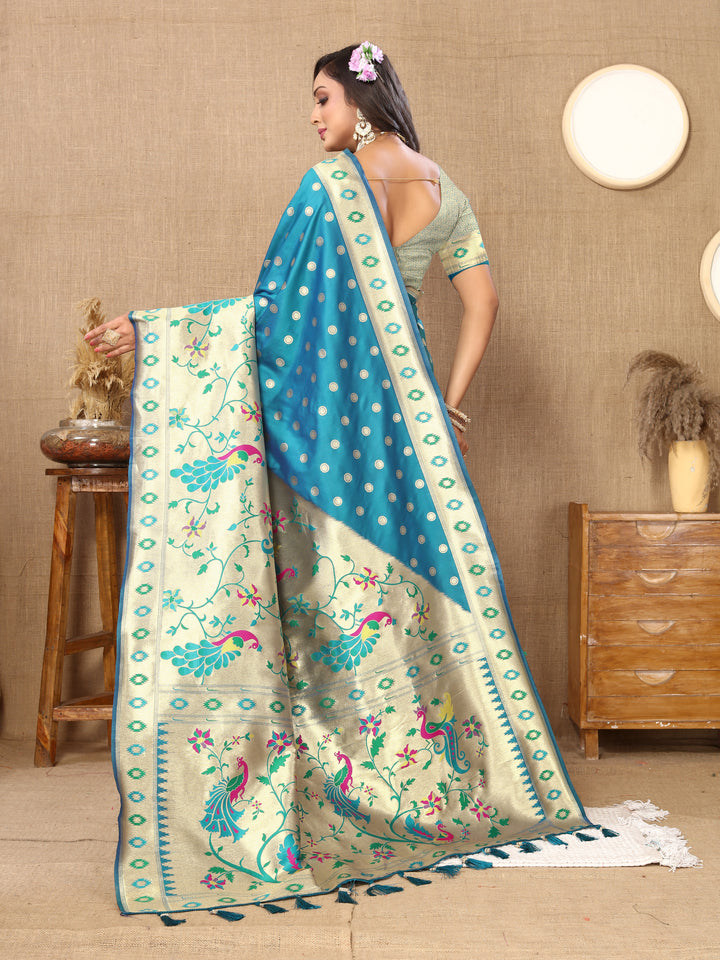 Turquoise silk saree with intricate zari weaving, ideal for Indian celebrations.