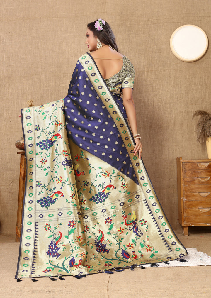 Timeless navy Paithani saree featuring rich zari pallu, ideal for traditional gatherings.