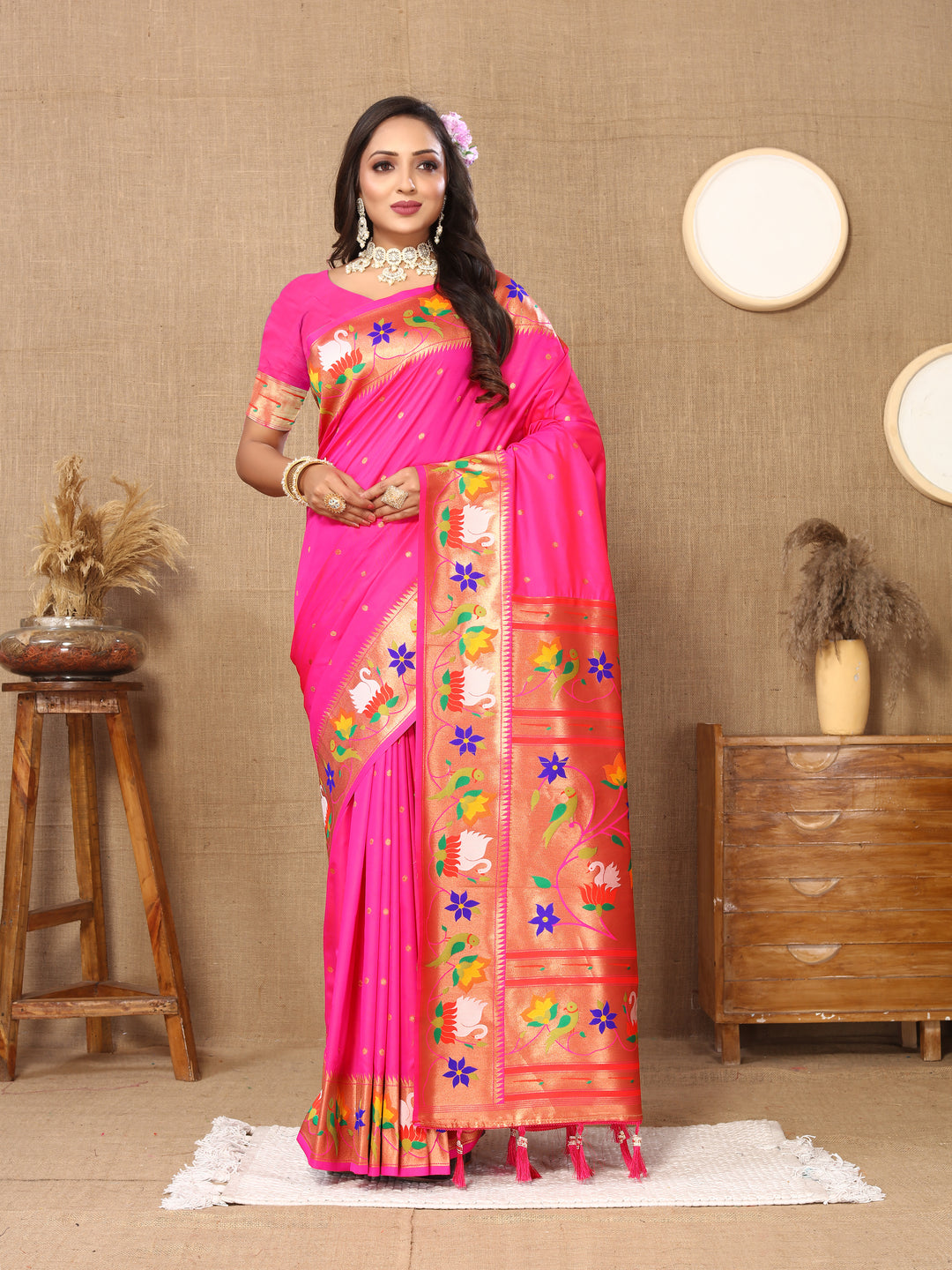 Elegant pale-pink Paithani silk saree with delicate meenakari weaving and a luxurious zari border, perfect for bridal wear.