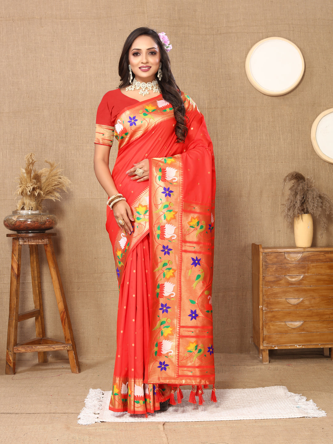 Vibrant red Paithani silk saree with detailed meenakari weaving and a gold zari border, perfect for weddings.