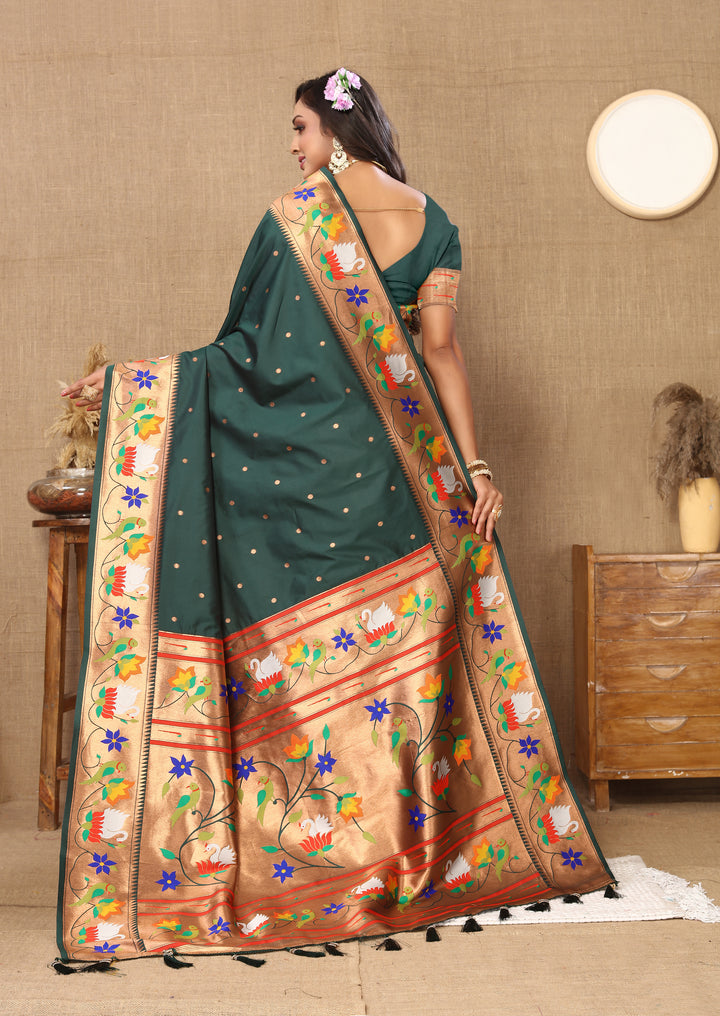 Elegant wine Paithani silk saree featuring rich meenakari work and a golden zari border, perfect for festive celebrations.