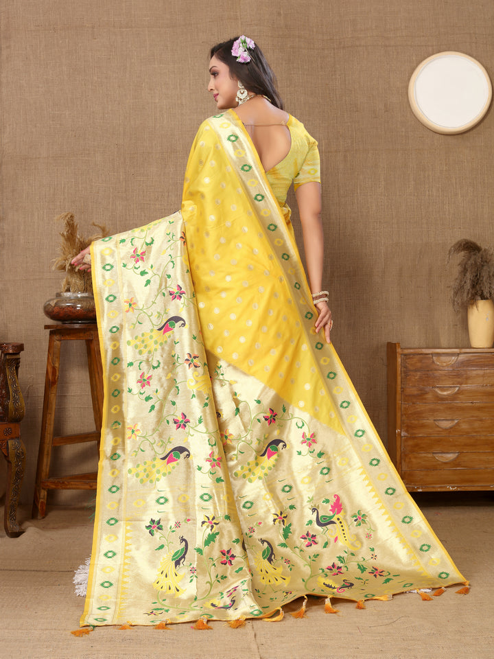 Yellow silk saree with rich zari weaving and silk blouse piece, perfect for cultural gatherings.