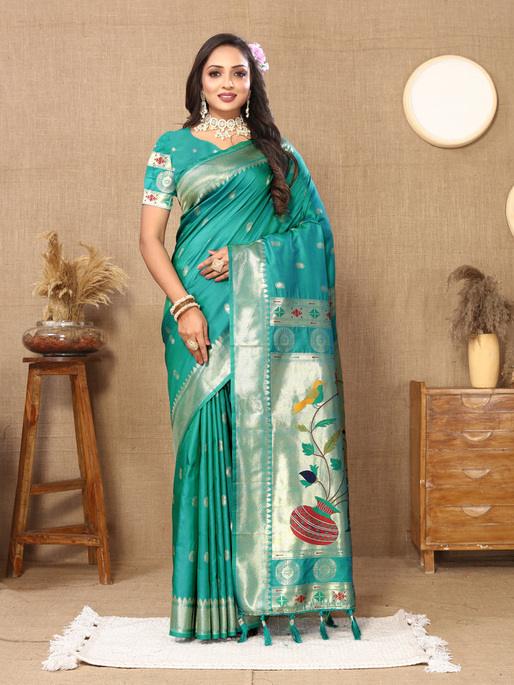 Stylish teal blue Paithani silk saree with intricate zari and meenakari work, perfect for Indian celebrations.