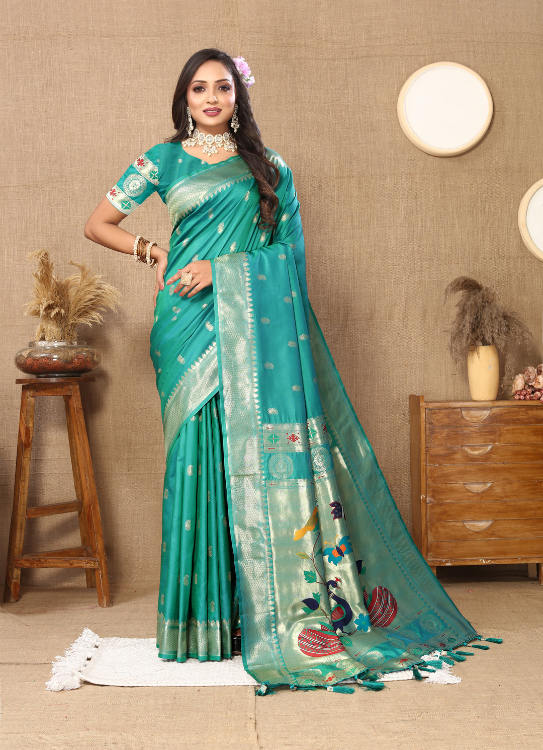 Elegant teal blue designer Paithani saree with luxurious zari work and meenakari details, ideal for weddings.