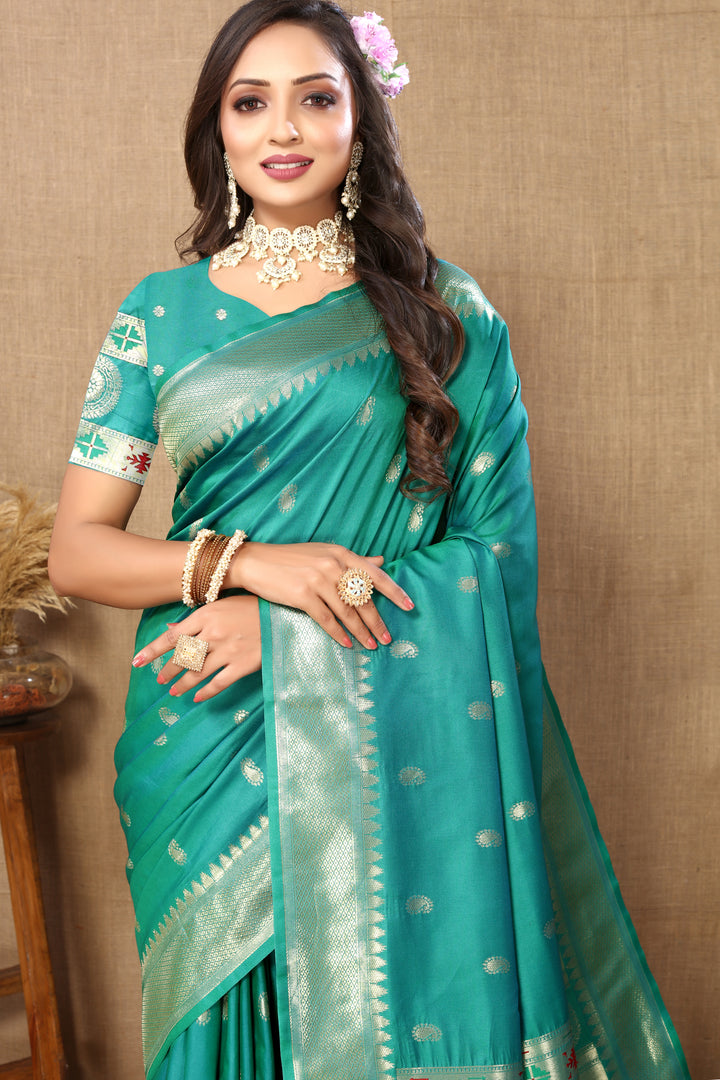 Teal blue Paithani silk saree with stunning zari and meenakari designs, perfect for cultural events.