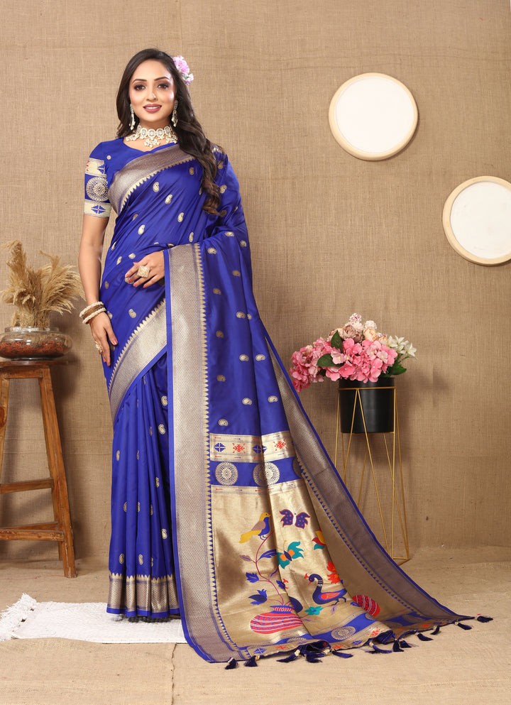 Elegant royal blue designer Paithani saree with matching blouse and luxurious zari detailing.