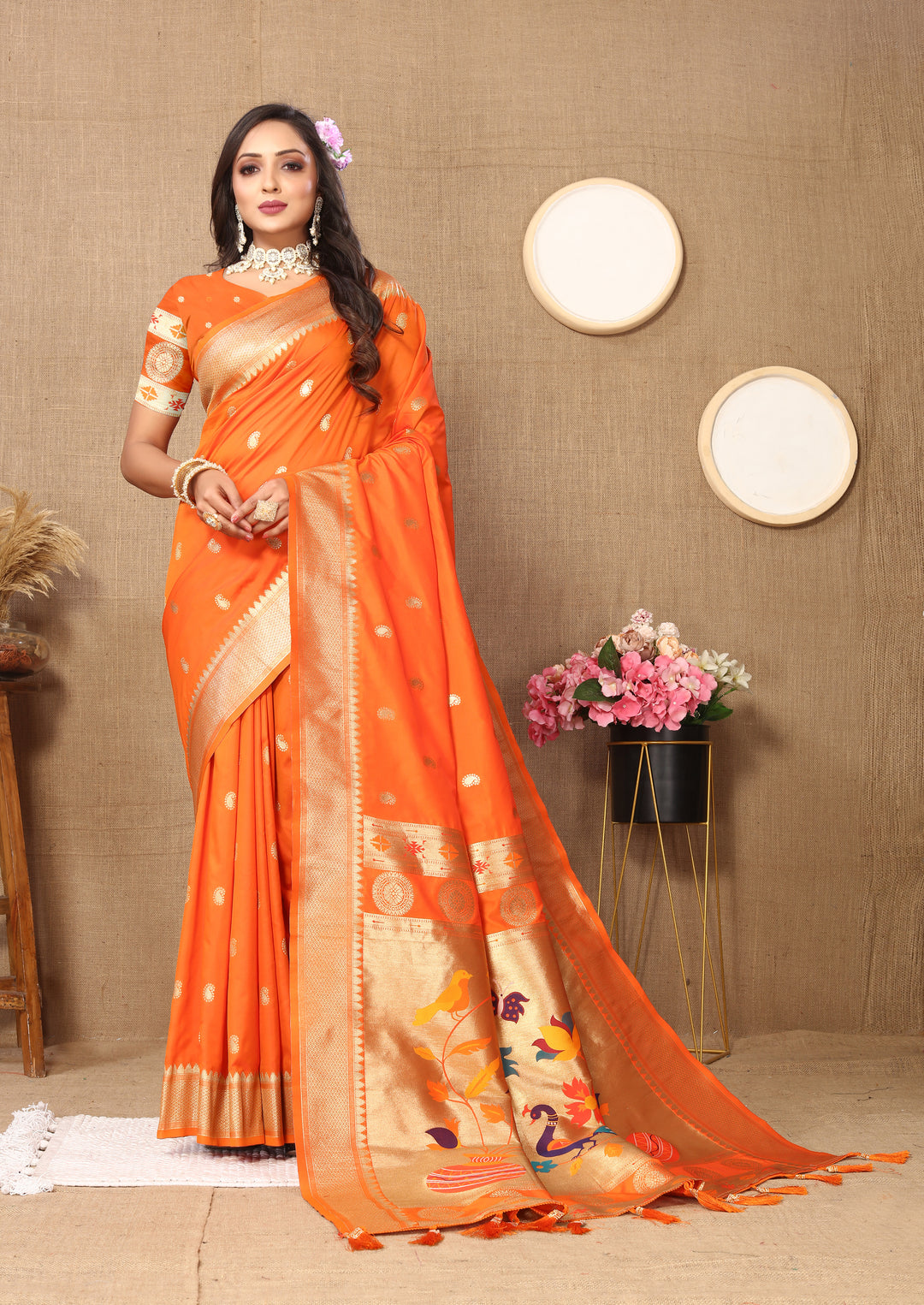 Vibrant orange Paithani silk saree with intricate zari and meenakari work, perfect for festivals.