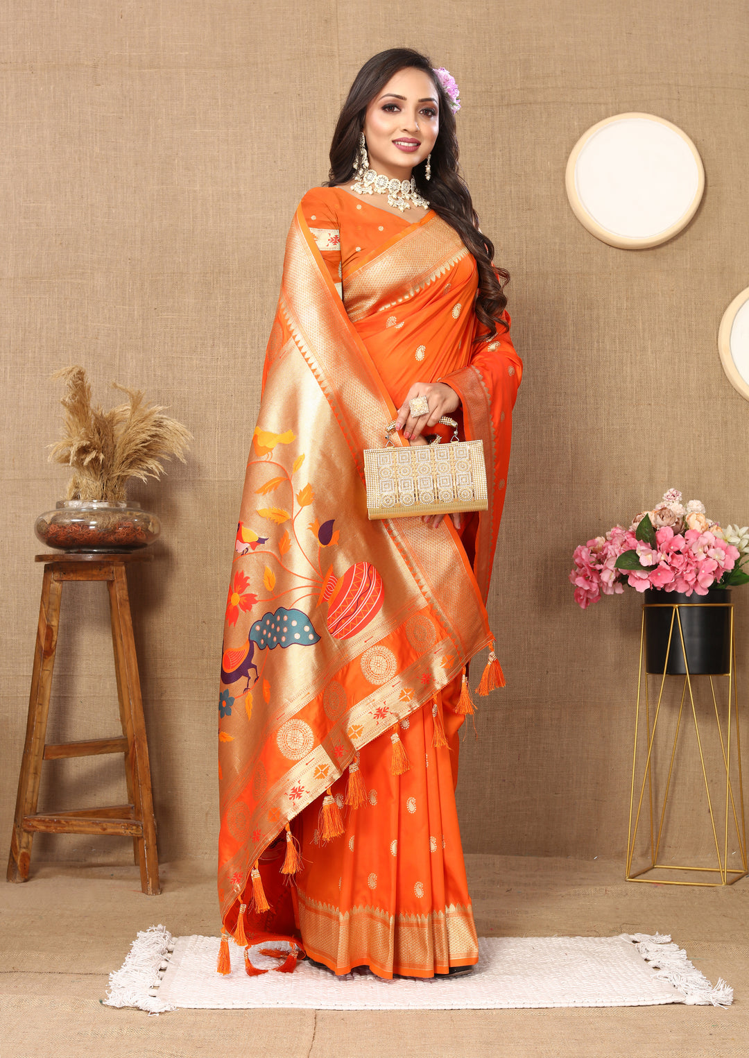 Elegant orange designer Paithani saree with luxurious zari work and matching blouse, ideal for weddings.