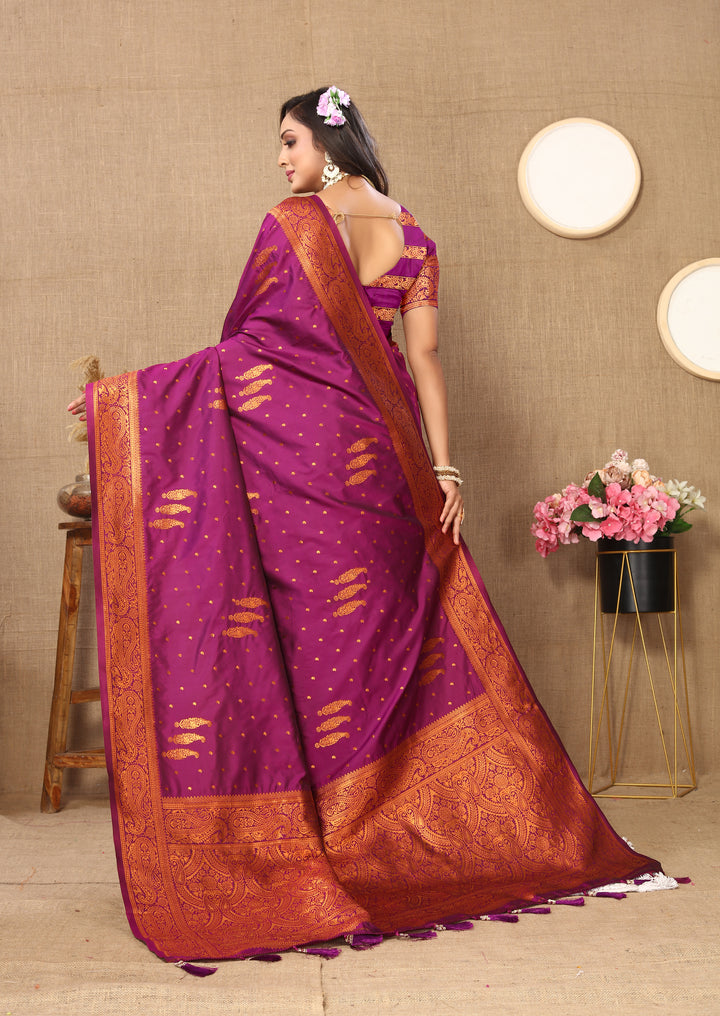 Timeless gray paisley saree with intricate zari work and contrasting border, great for elegant gatherings.