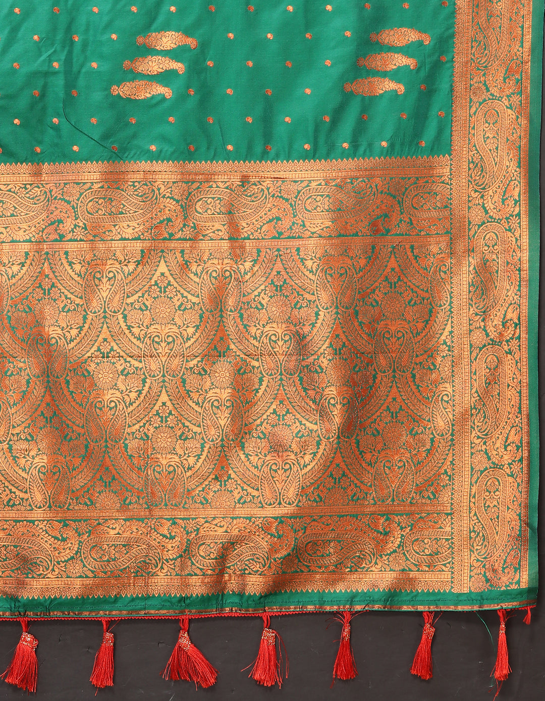 Opulent maroon paisley saree with intricate zari pallu and contrast border, perfect for weddings and cultural events.