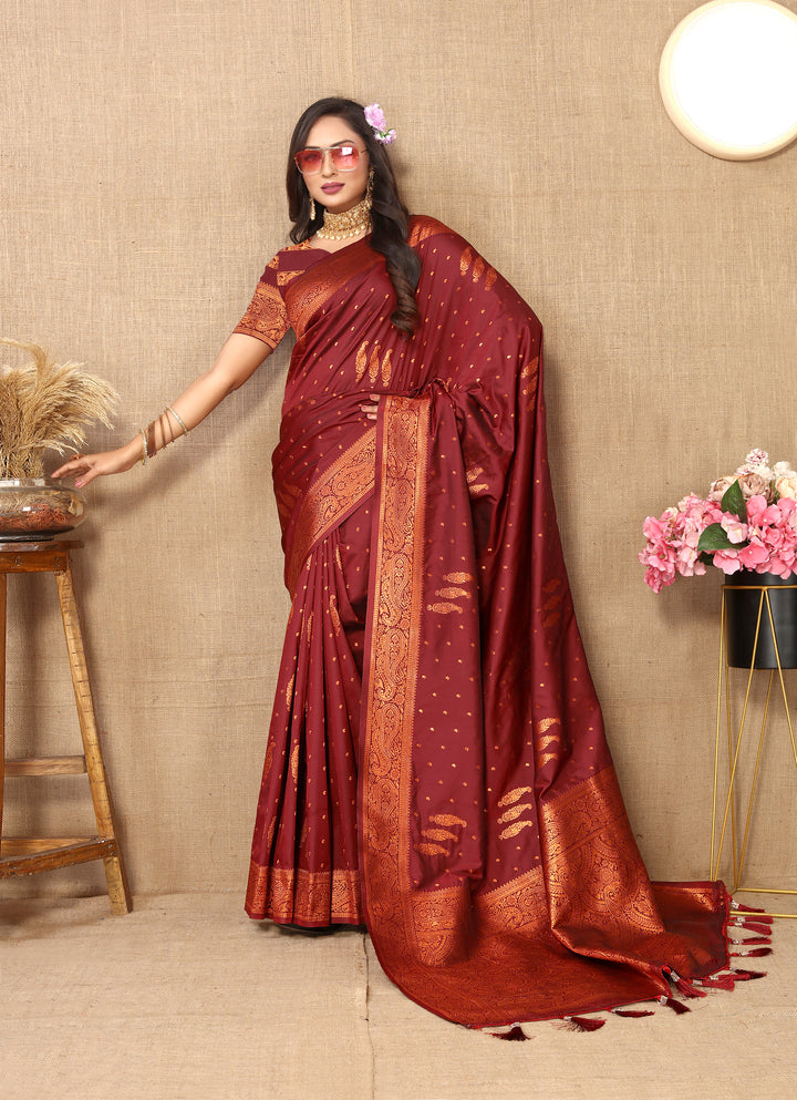 Stunning pink paisley saree with rich zari pallu and contrast border, designed for festive celebrations.