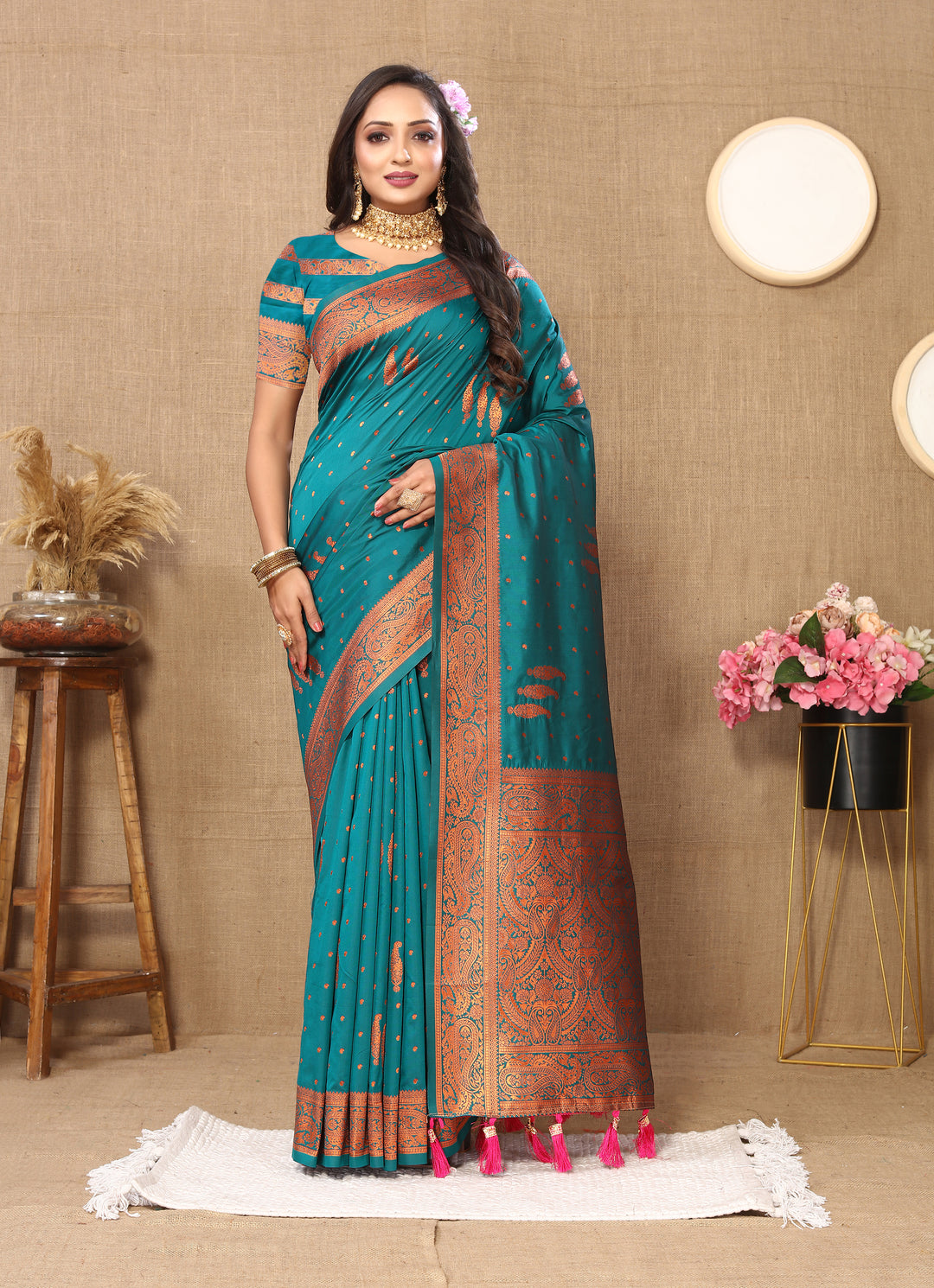 Elegant navy paisley saree with zari pallu and contrasting border, perfect for traditional gatherings.