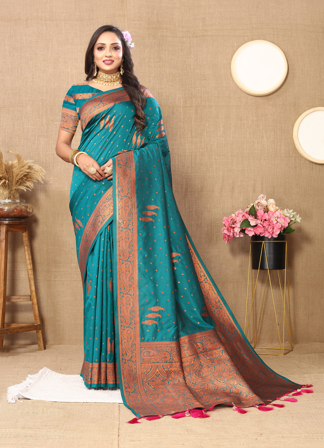 Classic navy paisley saree with intricate zari work and contrast border, great for weddings and cultural events.