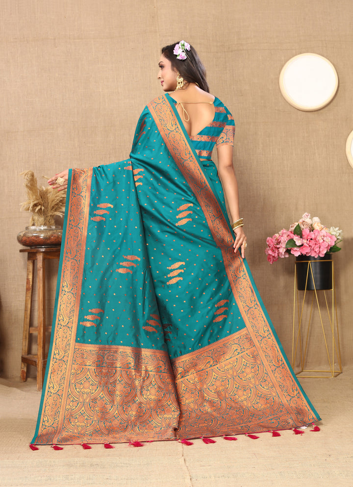 Gorgeous teal-blue paisley saree with zari pallu and contrast border, perfect for weddings and cultural events.