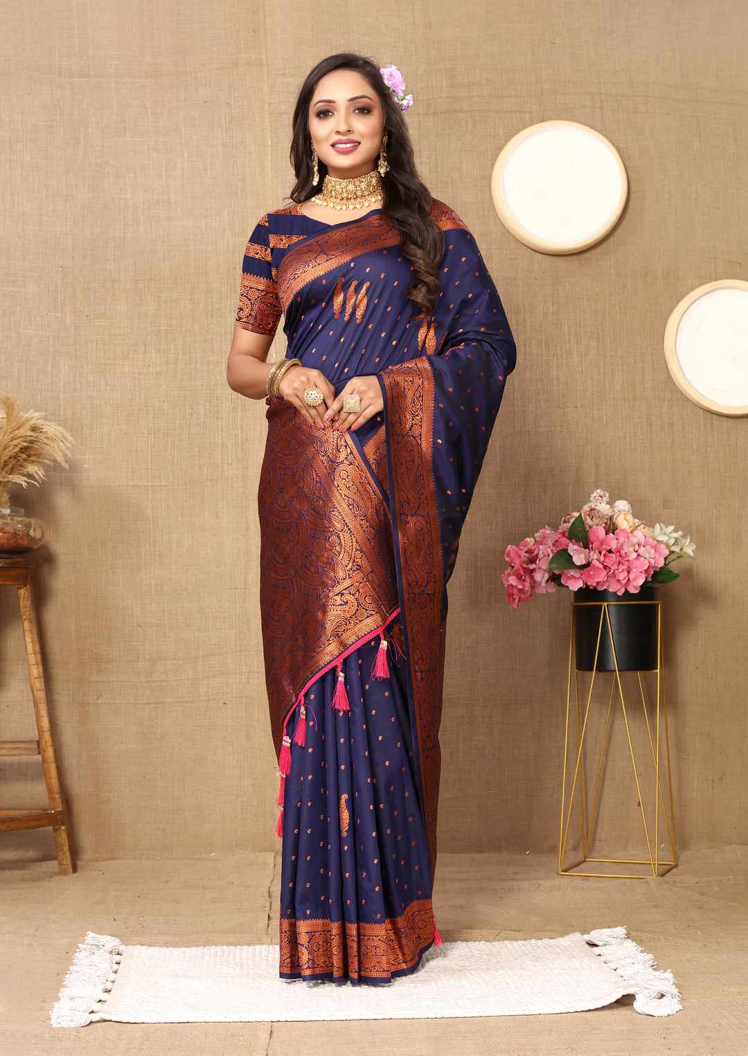 Stylish maroon paisley saree with rich zari pallu and contrast border, perfect for formal celebrations.