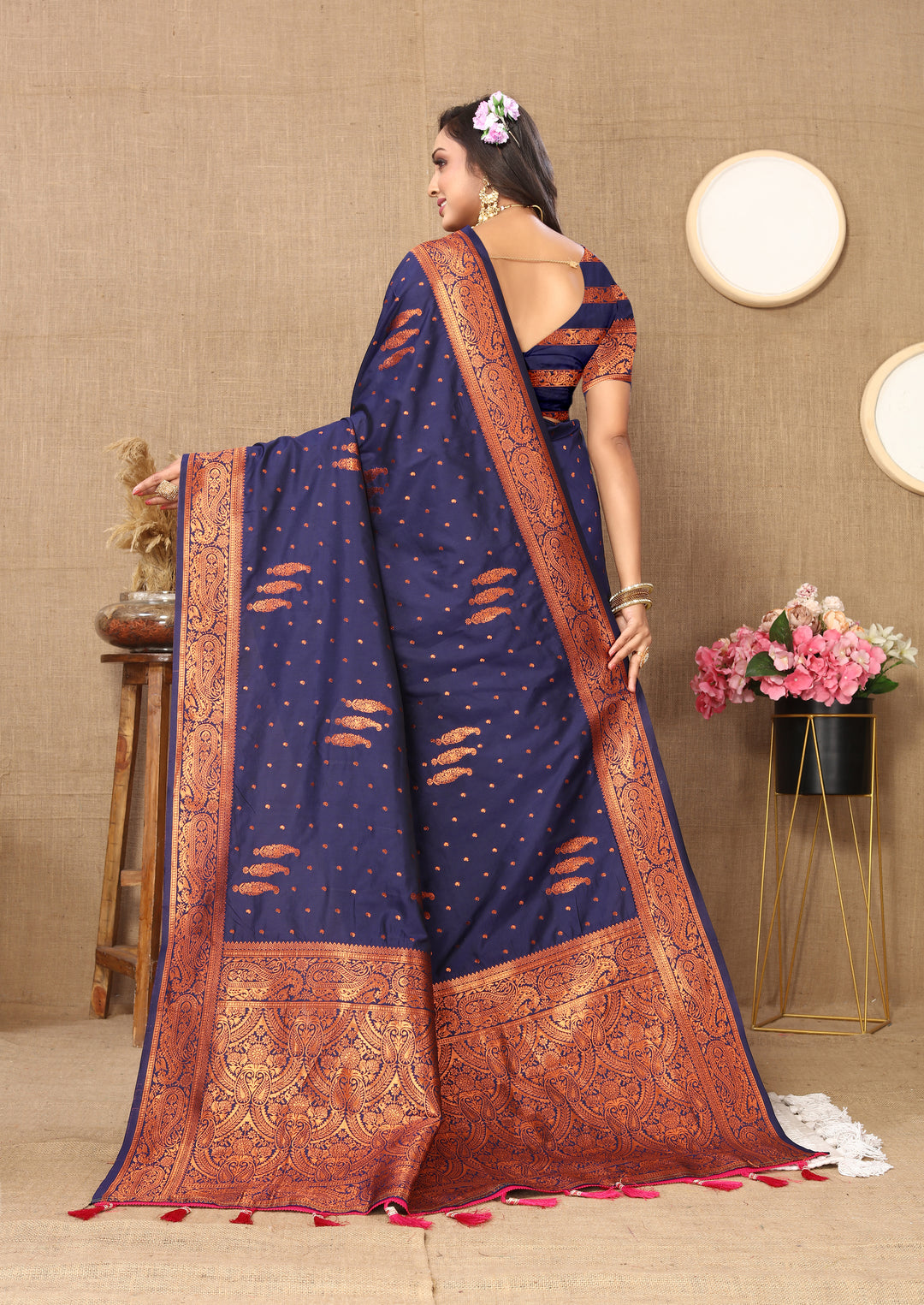 Graceful navy paisley saree with zari pallu and contrast border, perfect for festive events.