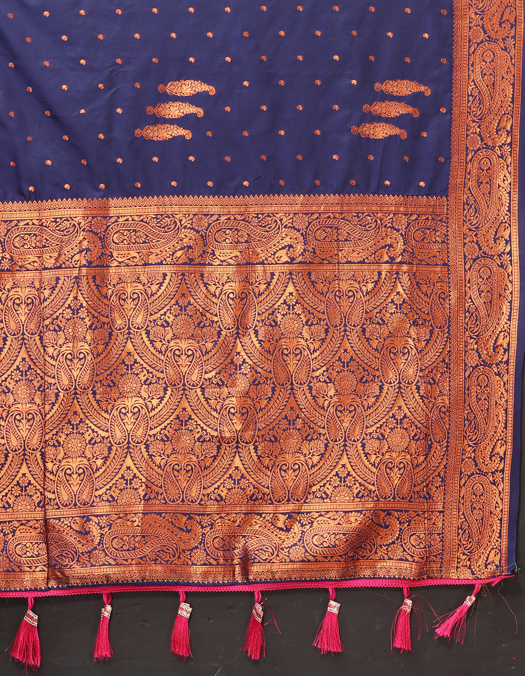 Elegant teal-blue paisley saree with rich zari pallu and contrast border, great for weddings.