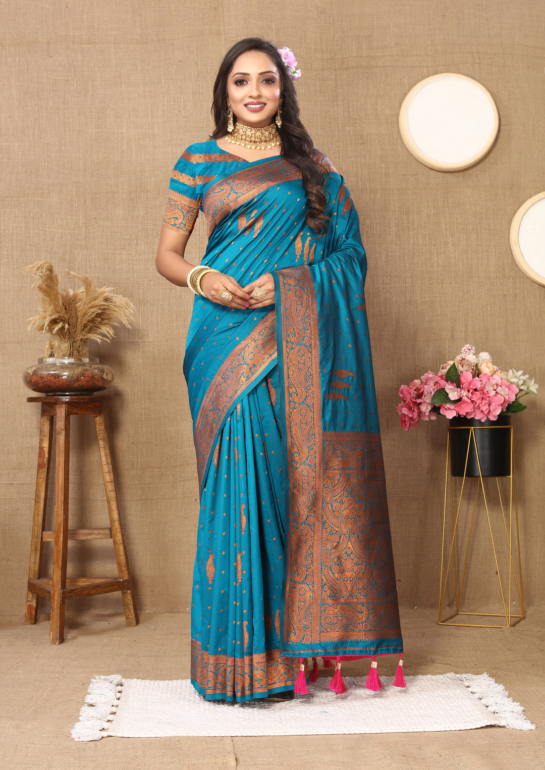 Vibrant gray paisley saree with rich zari pallu and contrast border, perfect for festive wear.