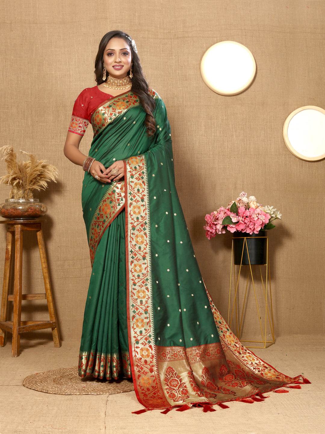 Teal green Paithani silk saree featuring intricate Meenakari work and a beautiful zari-adorned pallu.