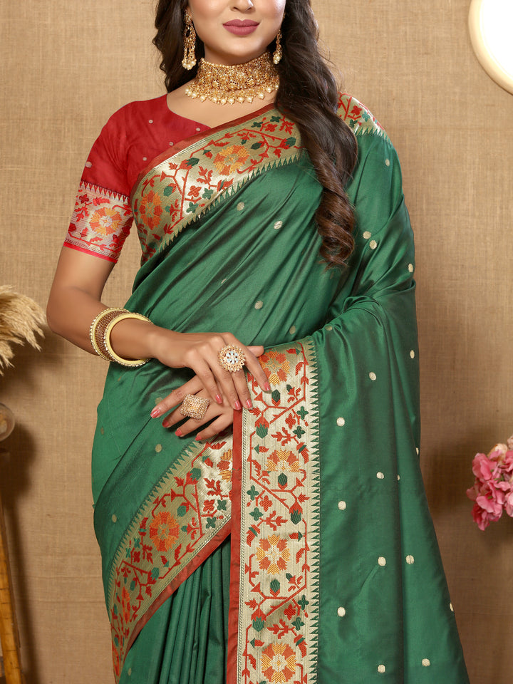 Rich teal green Paithani saree with detailed Meenakari weaving and a zari pallu, ideal for weddings.