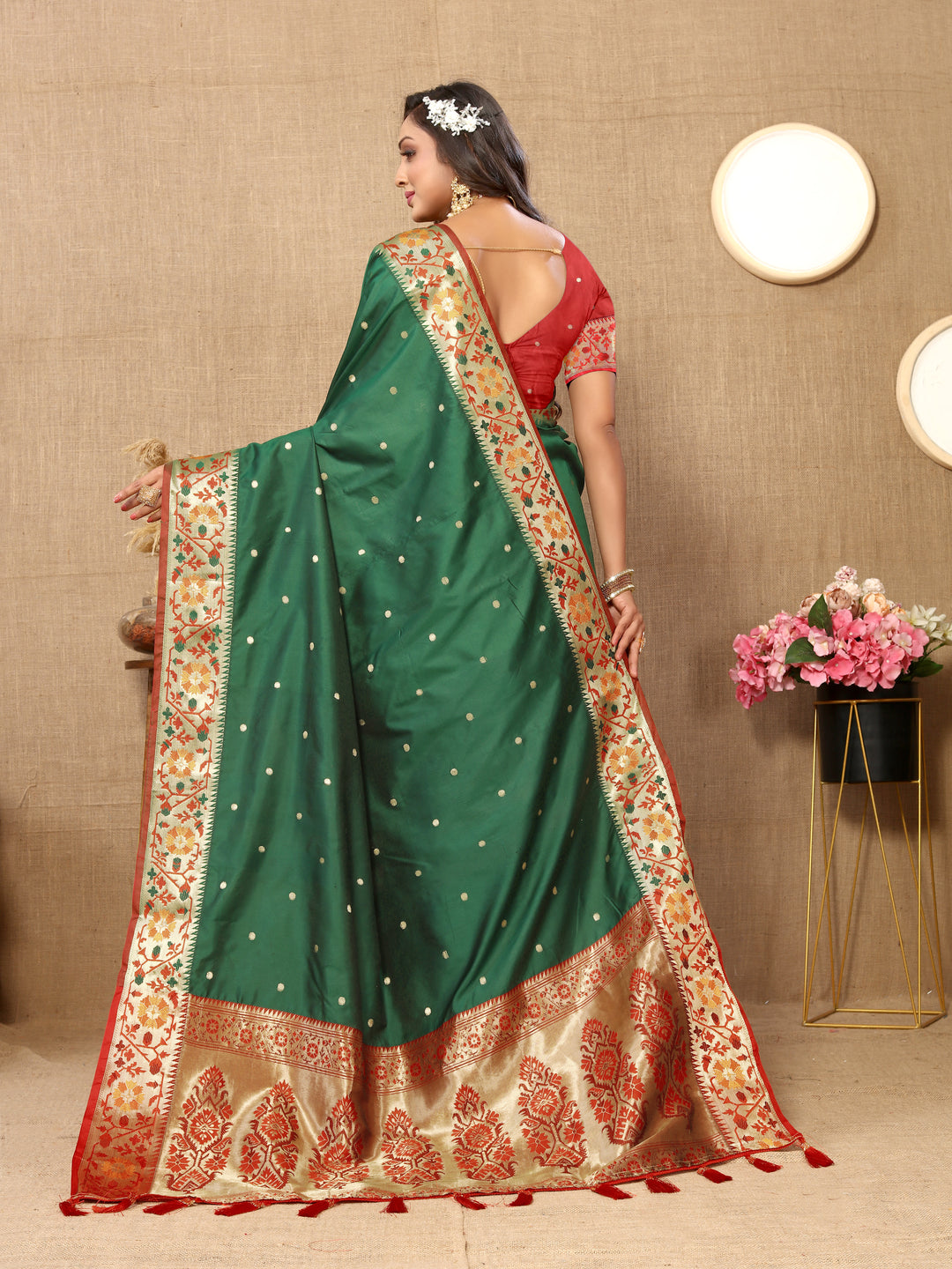 Teal green silk saree with Meenakari weaving and zari pallu, perfect for cultural celebrations.