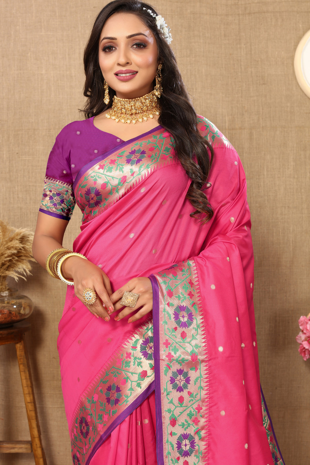 Elegant pink Paithani silk saree with intricate Meenakari motifs and a stunning zari pallu.