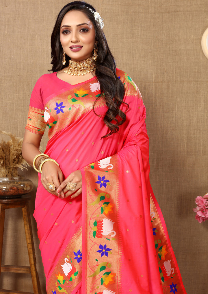 Bright pink Paithani silk saree, delicate meenakari weaving, zari border.