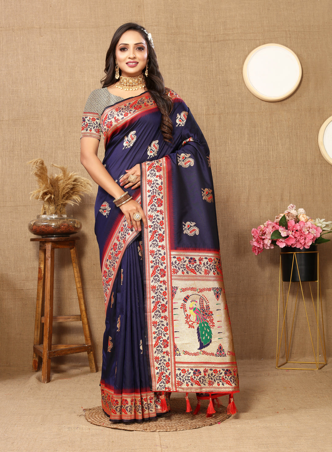 Navy Paithani silk saree with intricate zari border and chic tassels, ideal for cultural gatherings.