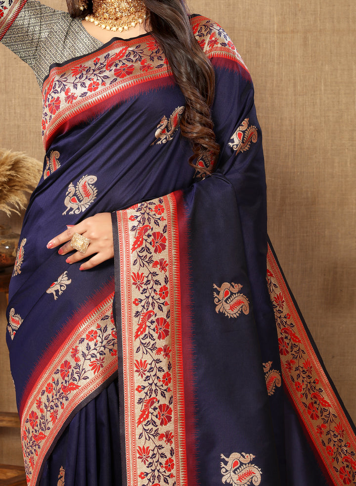 Navy Paithani silk saree with sophisticated zari border and tassels, ideal for traditional events.