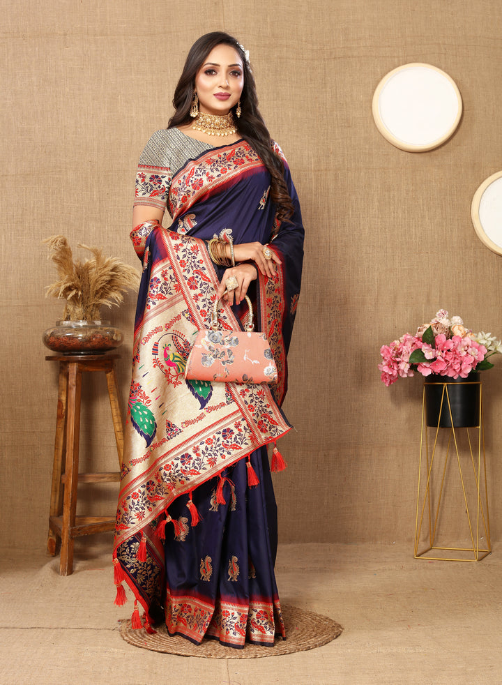 Timeless navy silk saree with rich zari and stylish tassels, perfect for Indian celebrations.