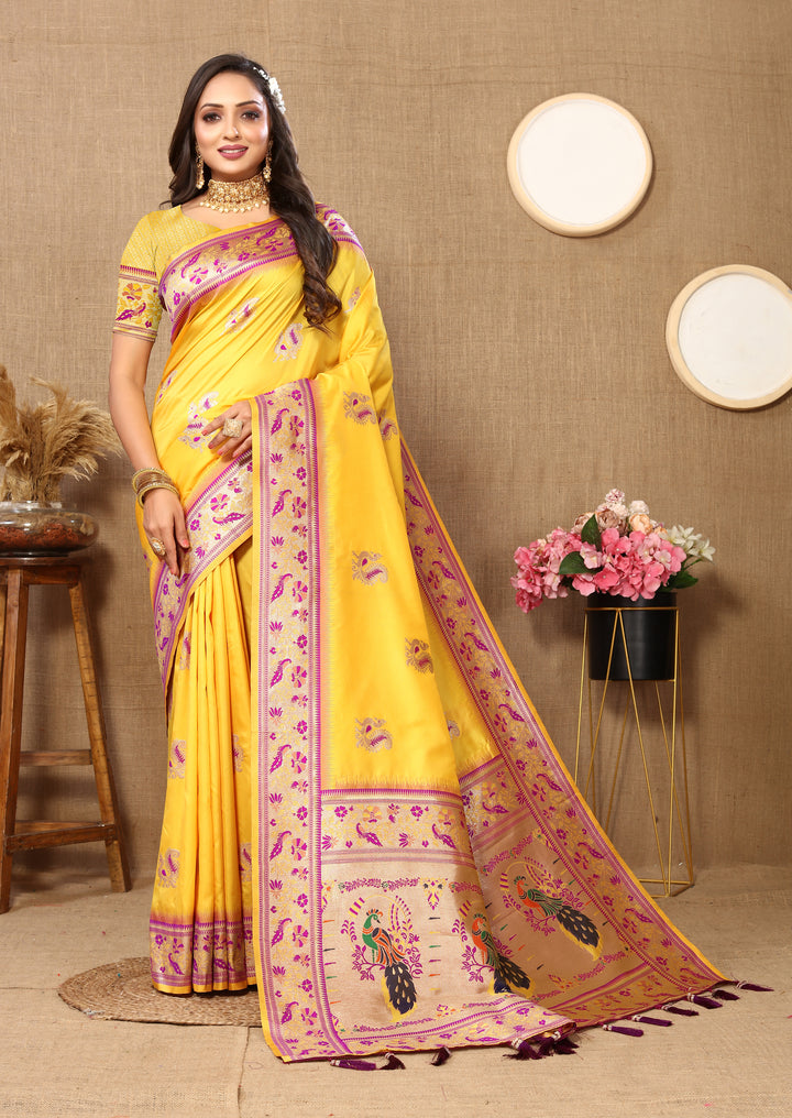 Designer yellow Paithani silk saree with zari border and chic tassels, perfect for grand occasions.