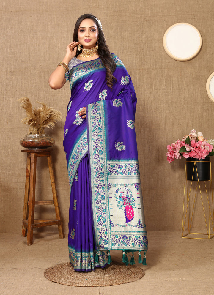 Elegant blue silk saree with zari border and stylish tassels, ideal for weddings.