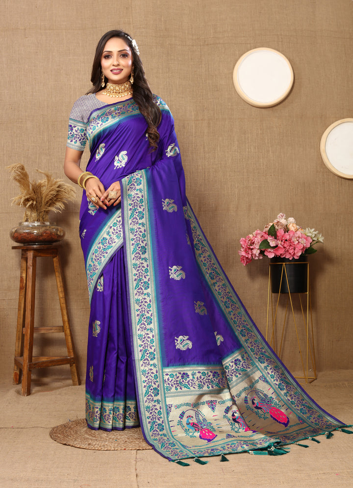 Designer blue Paithani silk saree with beautiful zari border and chic tassels, perfect for grand events.